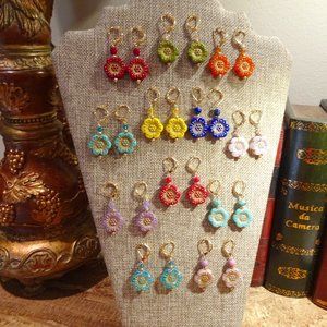 Handcrafted artisanal earrings with  whimsical Czech windflowers in 12 colors